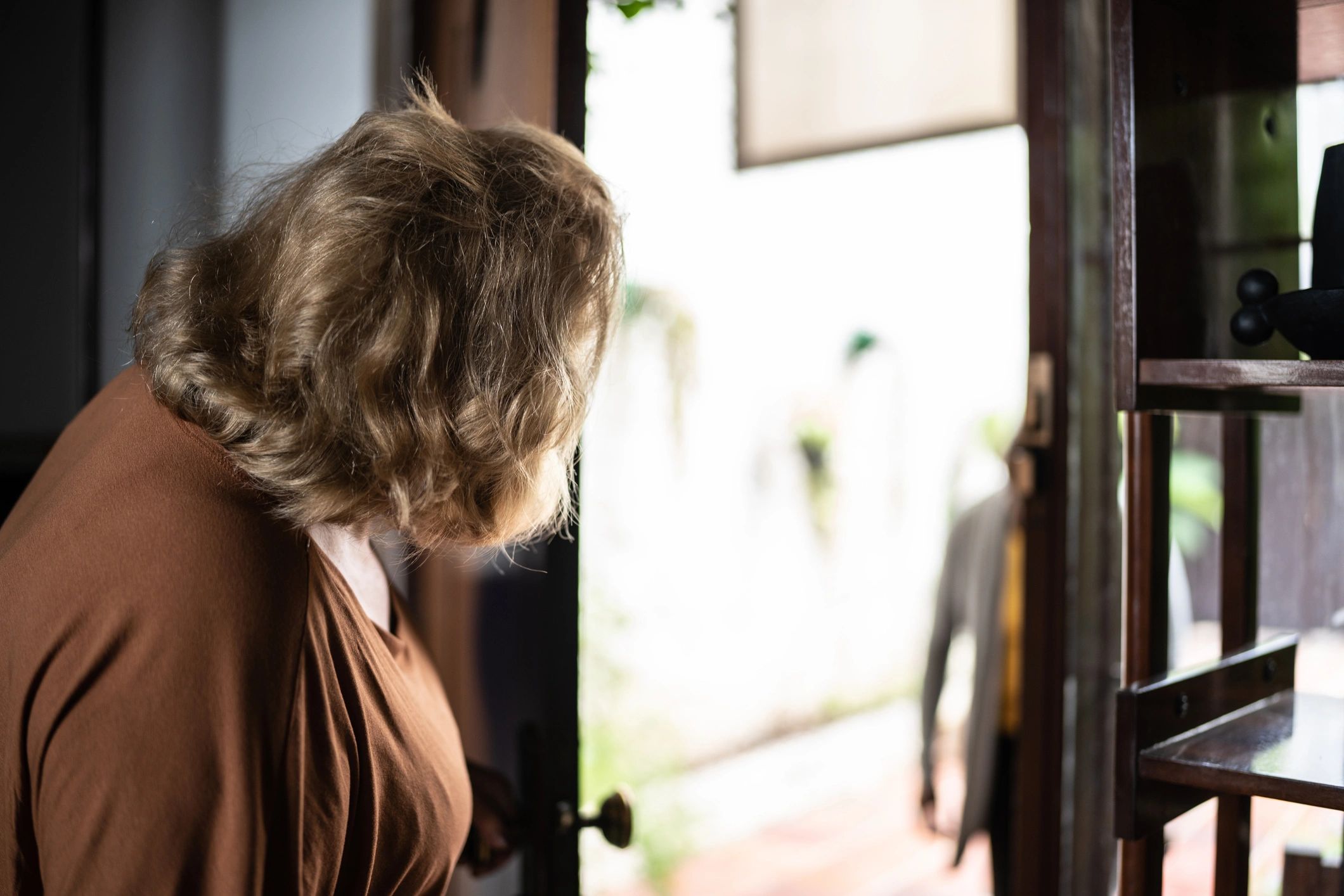 Homeowner opening the front door